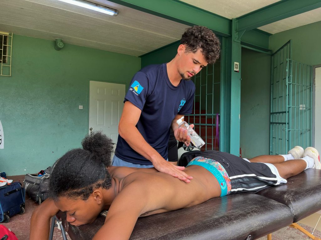 Therapist providing treatment to athlete in St Lucia